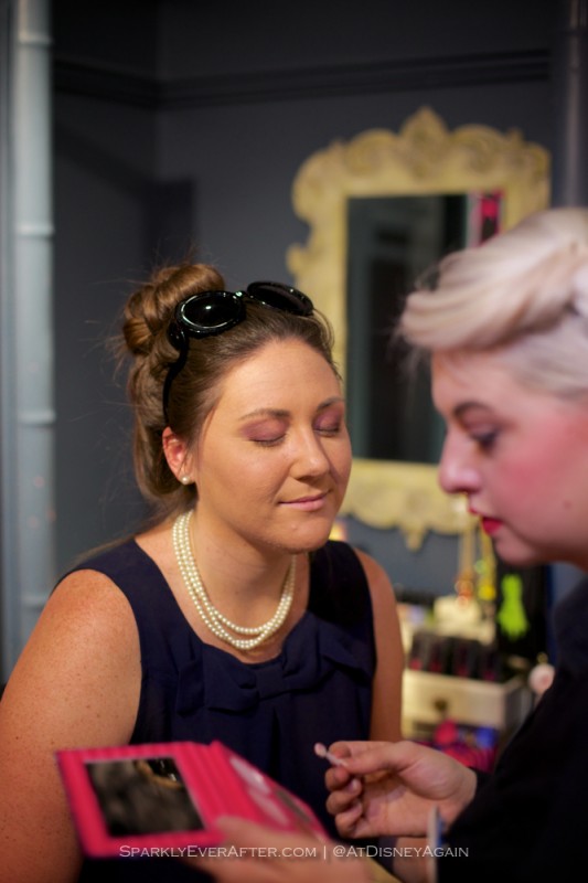 Sparkly Nicole gets her makeup done at the Curiouser and Curiouser Disney makeup launch