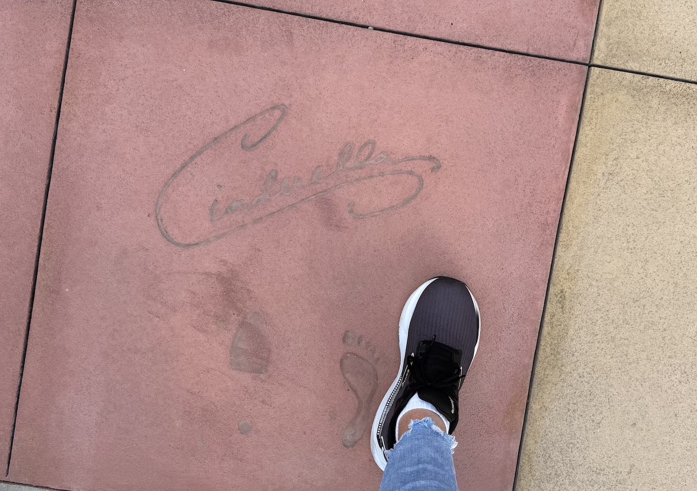 Cinderella's signature, footprint and slipper print in the cement at Hollywood Studios.
